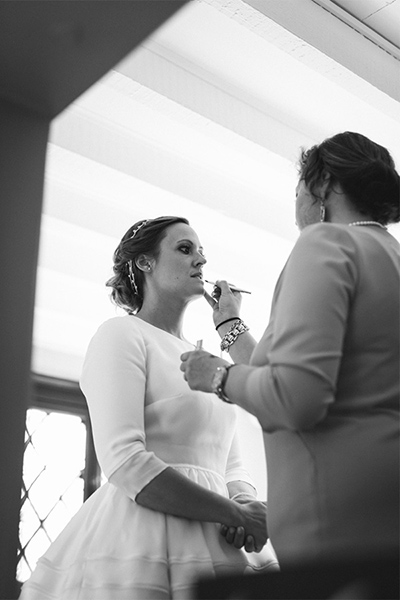 bride having final touches put on