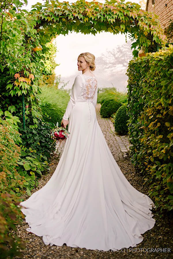 bride wearing wedding dress in makeup