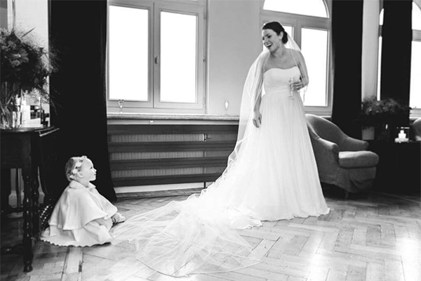 bride and baby laughing