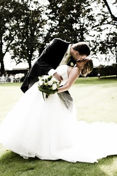 groom kissing bride