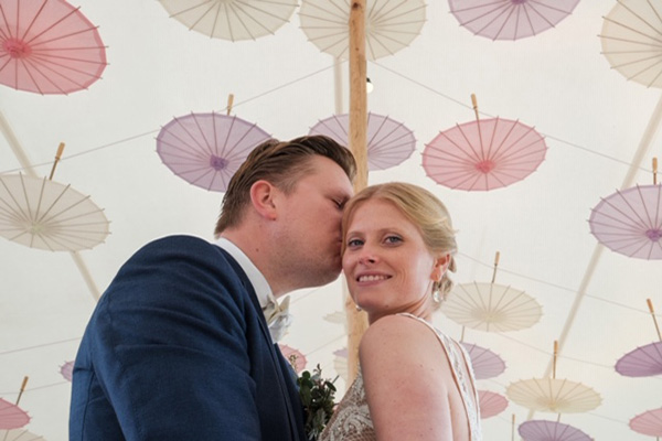 couple kissing after wedding