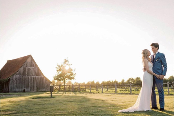 wedding photo by barn