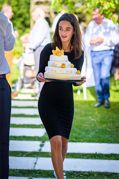 teen carrying cake